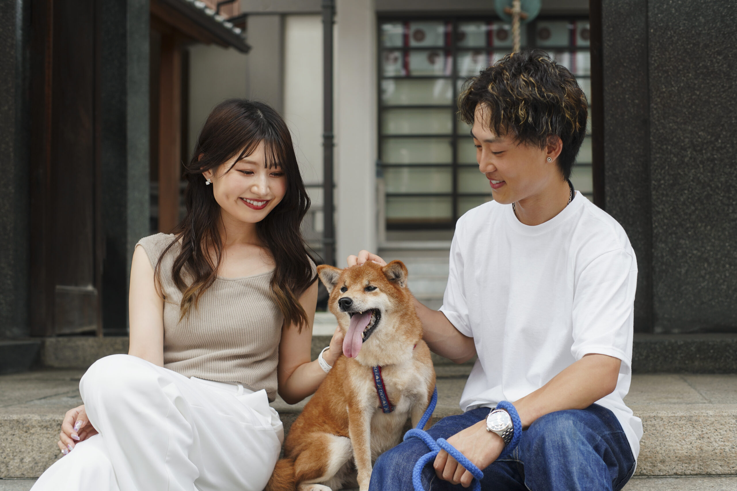 asian-man-woman-with-their-shiba-inu-dog-outdoors
